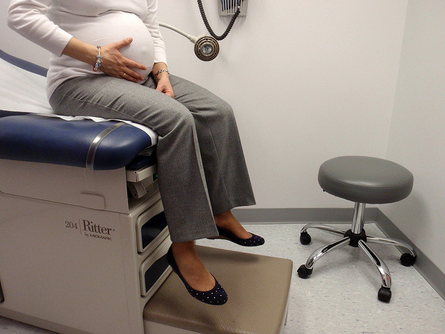 Woman in pregnancy waits in ob-gyn office