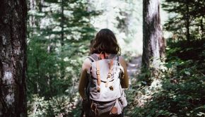 Girl on path in forest