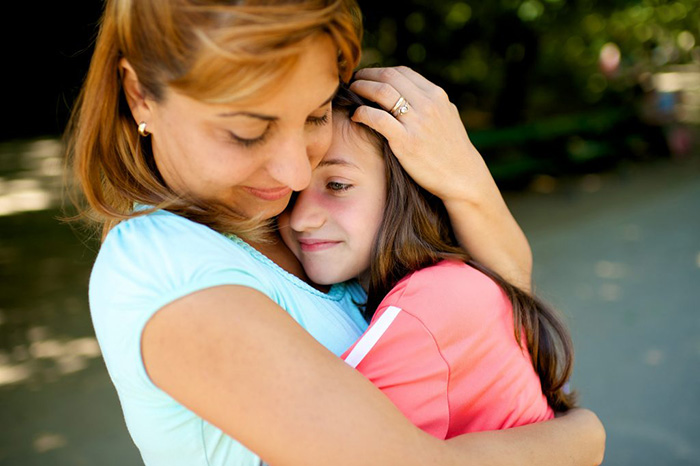 Daughter hugs mom for mothers day