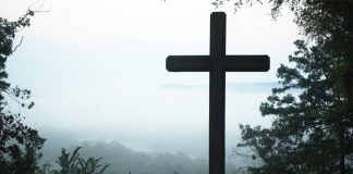 The cross of Jesus Christ with misty background