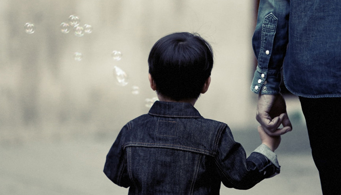 Boy blowing bubbles