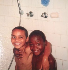 Mozambican orphans reunited take bath