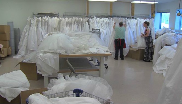 Women sort through DI wedding dress donation