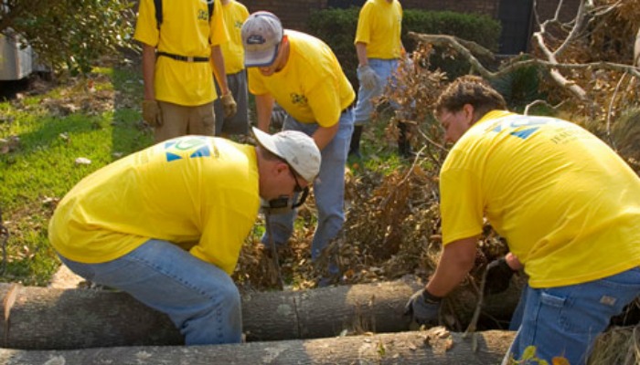 Mormon Helping Hands volunteers help clear downed tree after Katrina