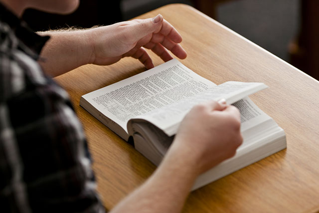 College student reading the scriptures