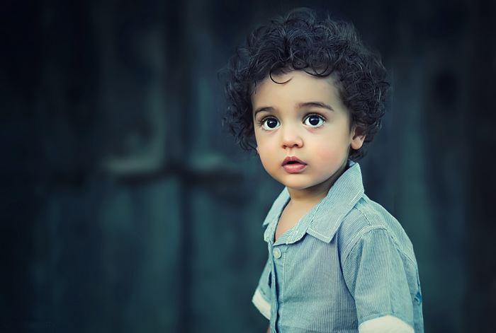 Toddler with dark curly hair