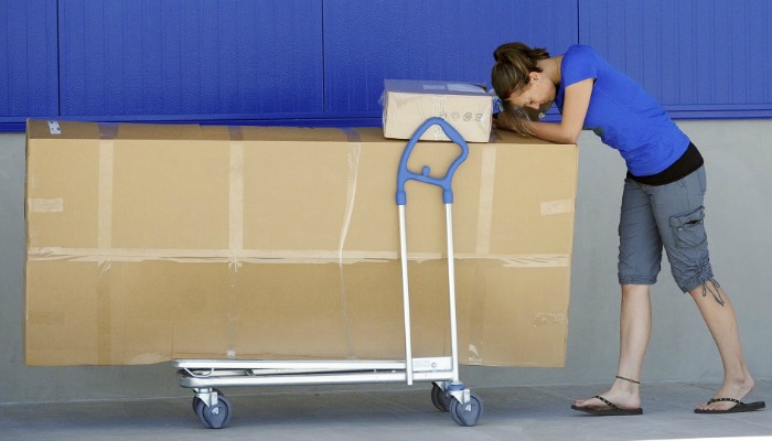 ikea nightmare woman pushing boxes