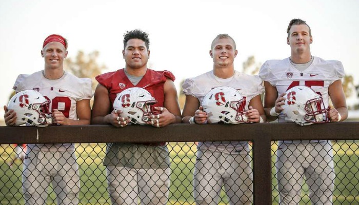 Left to Right) Stanford football players Dallas Lloyd, Brandon Fanaika, Sean Barton and Lane Veach pose for a photo after football practice on Tuesday, Sept. 13, 2016 in Stanford, Calif.