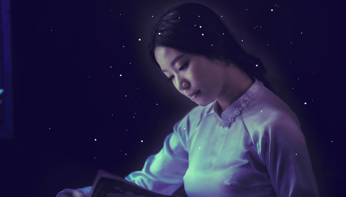 girl reading with stars