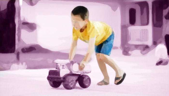 Child with toy truck graphic