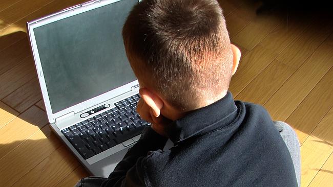 child at laptop