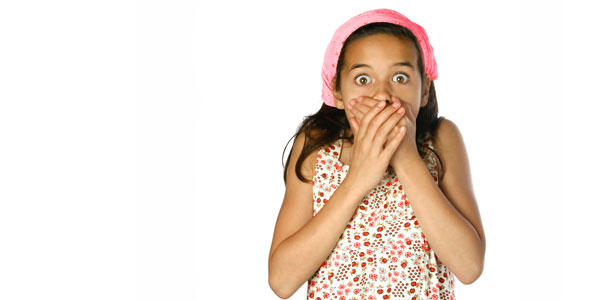 girl covering mouth