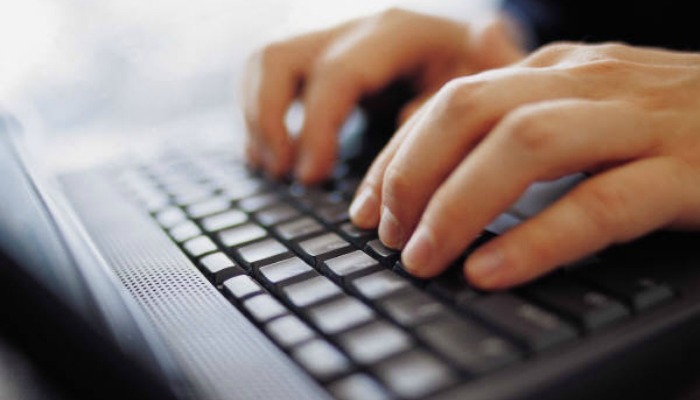 person typing religious freedom leaks