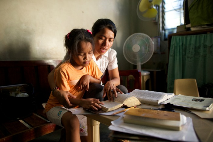 mother and child study together