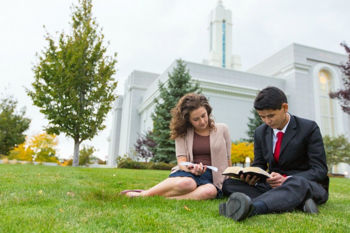 man and woman reading on temple lawn