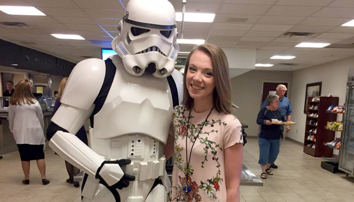 Marian Spencer poses with a stormtrooper in the Church Office Building cafeteria on Star Wars Day.