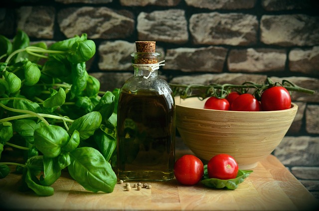 Basil, Olive Oil, Tomatos on a table