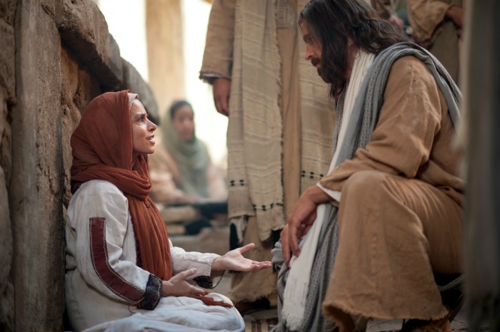 Jesus heals the woman with an issue of blood.