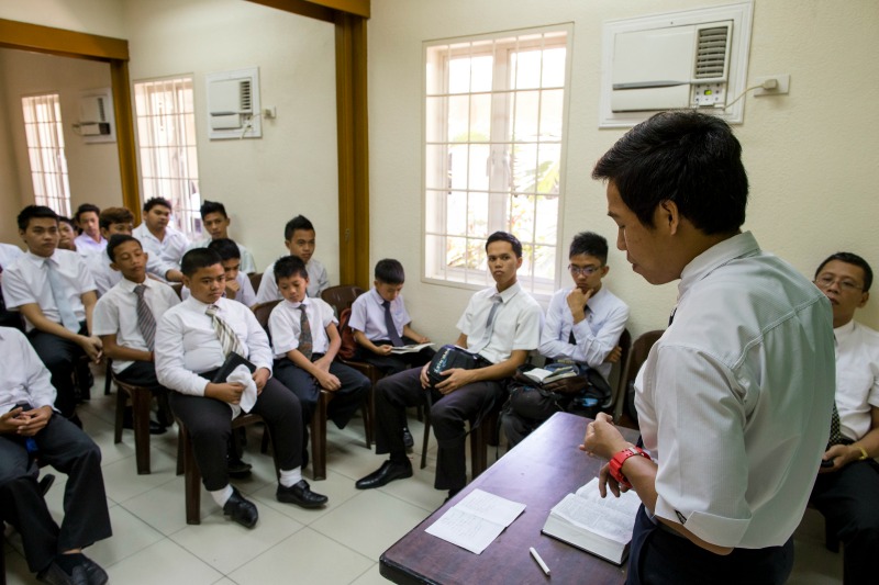 A young man teaches Sunday School.