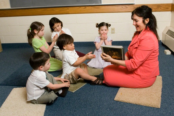 A primary teacher teaching a class