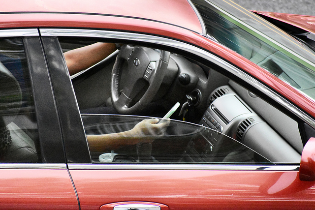 Texting below steering wheel