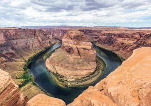 River flowing around a large rock formation