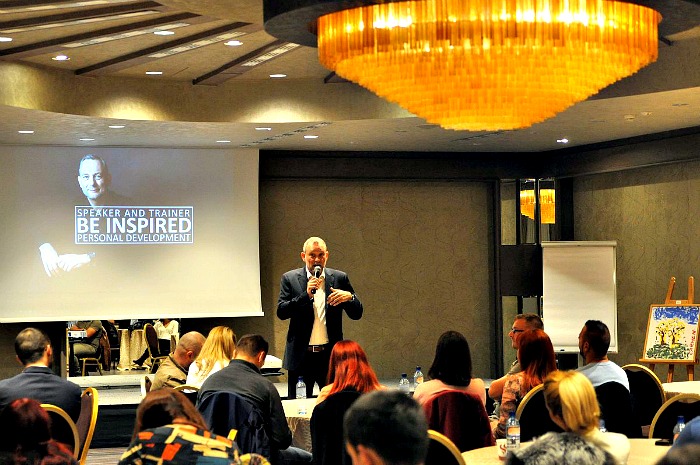 A man at a personal development seminar