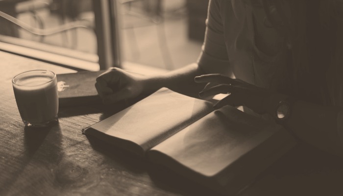 A person getting ready to write in a journal