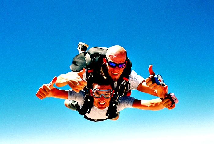 Two Men Smiling while skydiving