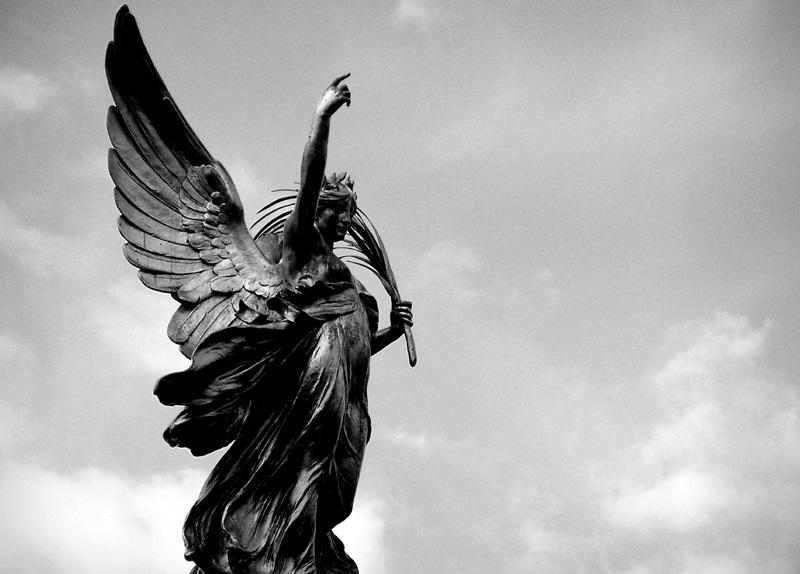 Angel Statue Pointing Upward