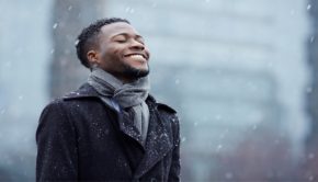 man enjoying falling snow