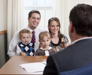 A bishop interviewing a family.