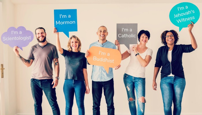 People from different religions smiling together.