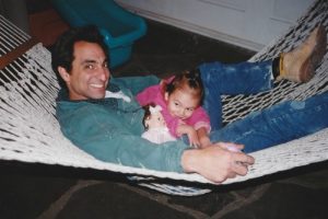 Father and baby on hammock