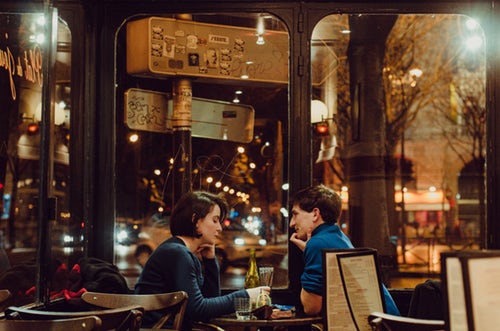 Couple on a date eating dinner