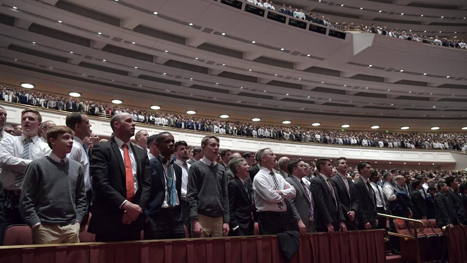 men stand at LDS general conference