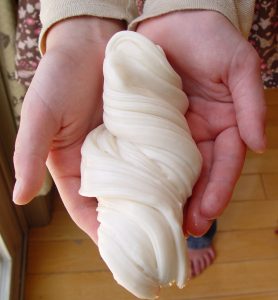 Someone Holding Taffy | 8 Family-Friendly Ways to Celebrate Pioneer Day | Third Hour | Pioneer Games LDS | Pioneer Day Activities | Pioneer Crafts & Activities