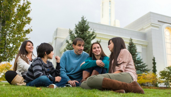 family outside temple