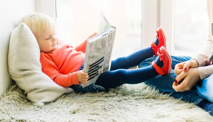 Child reading children's book.