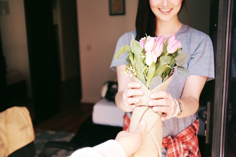 giving bouquet of flowers Valentine's Day