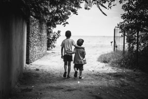 Two children walking together.