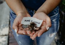 Hands holding coins and paper saying "Make a change"