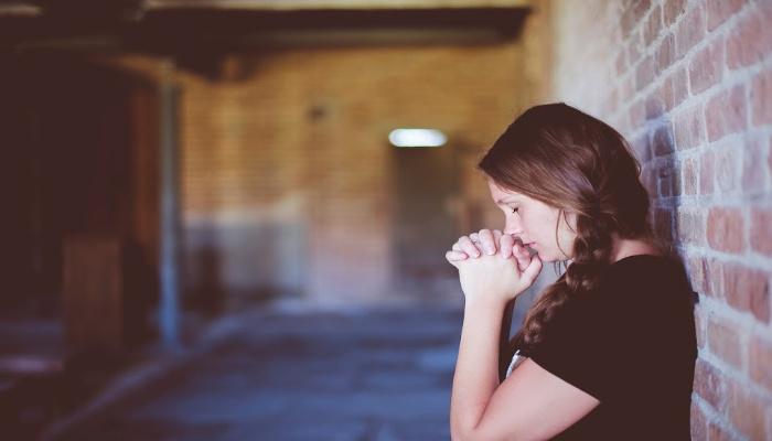 Woman Praying in Brick Hallway | Ether 12:27: The Truth Behind Our Weaknesses | Third Hour | Ether 12:27 Meaning | Weakness vs Weaknesses | I Give Unto Men Weakness | Esther 12:27