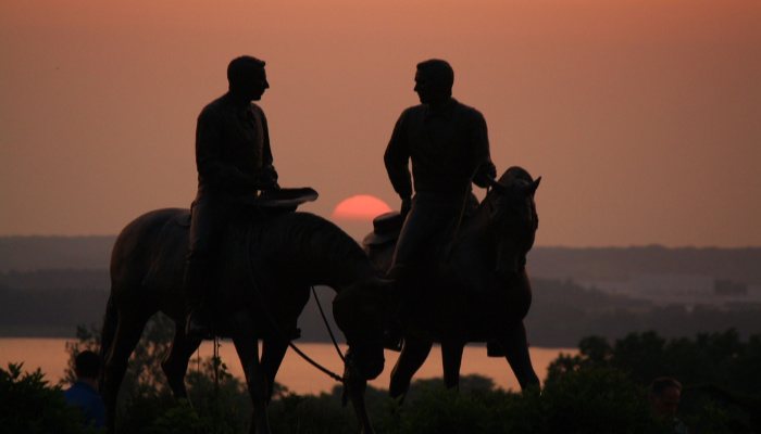 Joseph and Hyrum Smith on horseback sunset