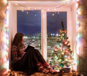 girl reading book Christmas