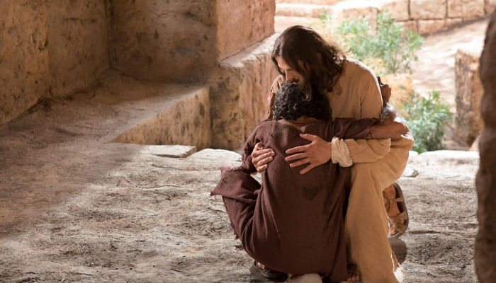 Jesus embraces blind man