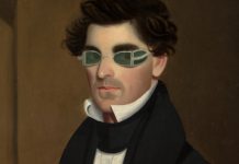 Portrait of man wearing curious specs.
