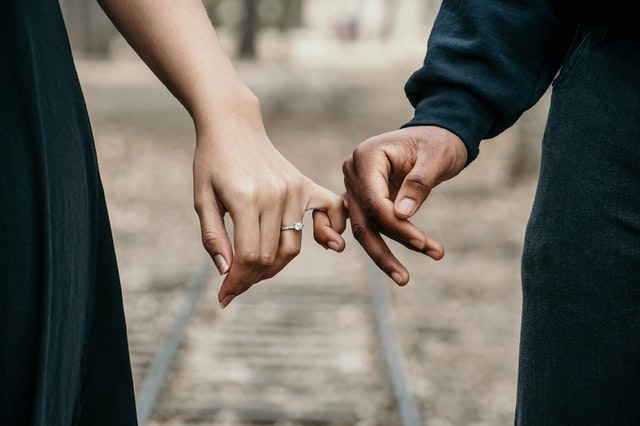 Husband and wife holding hands