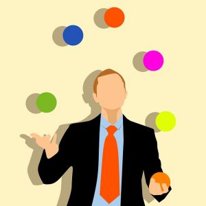 A clipart of a man juggling multicolored balls.