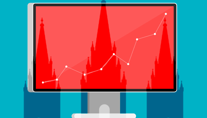 Mormon temple behind graph on computer.